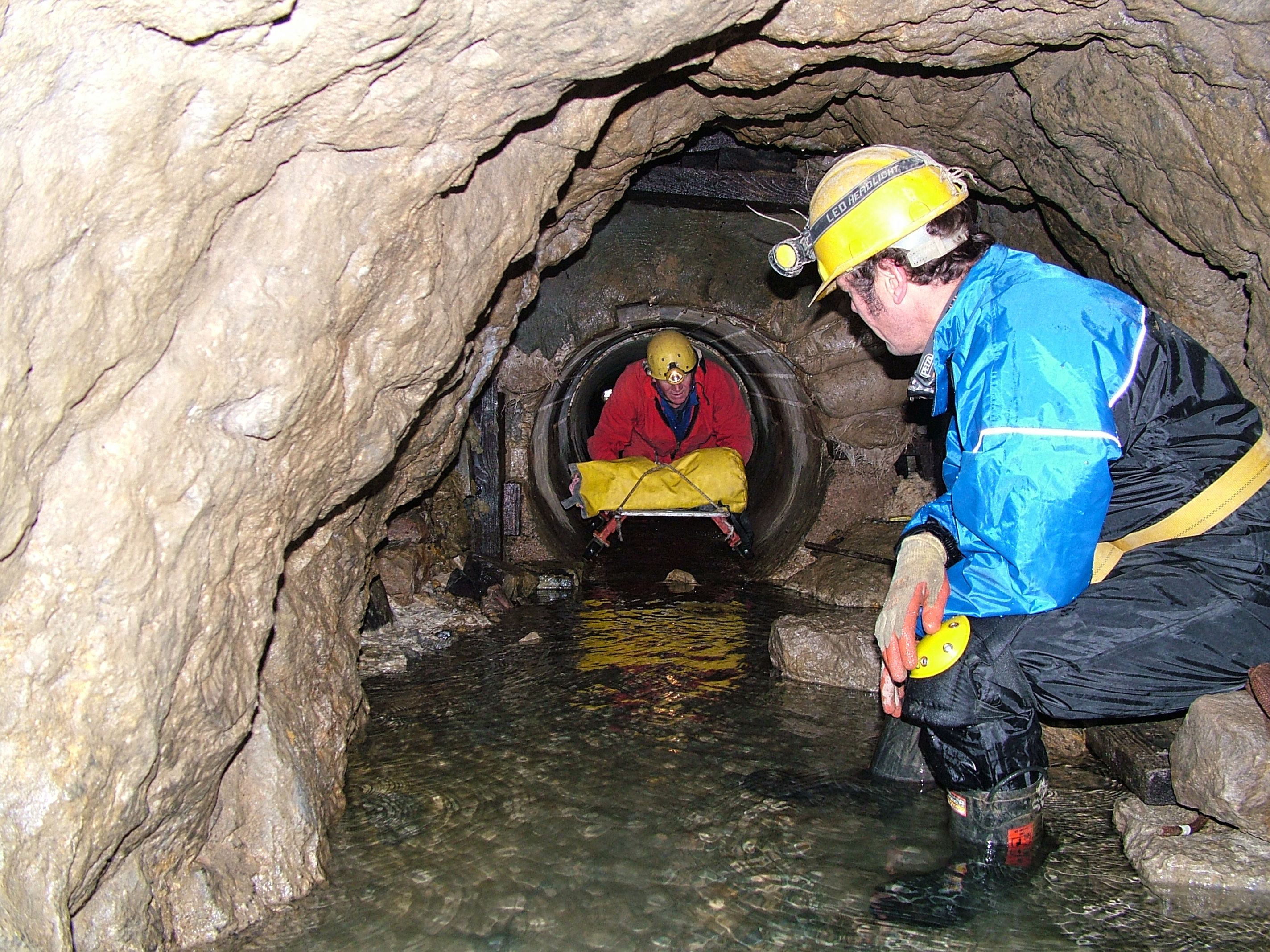 Brian emerging from the concrete lining pipes into the adit